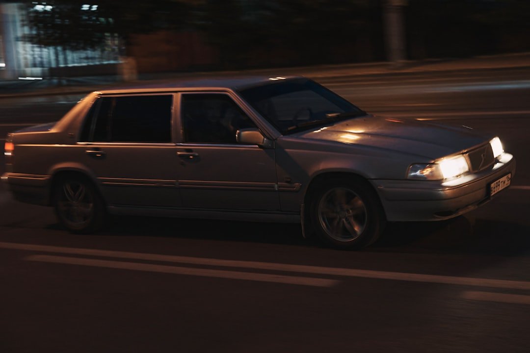 silver suv on road during night time