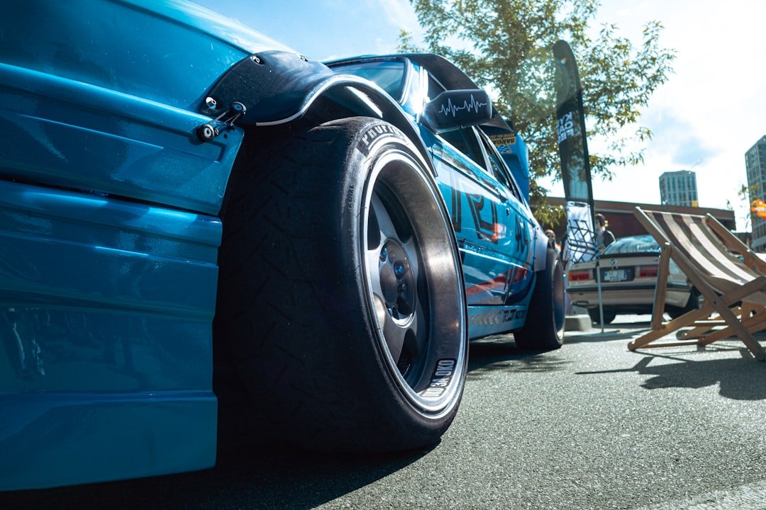 Blue car with a big wheel.