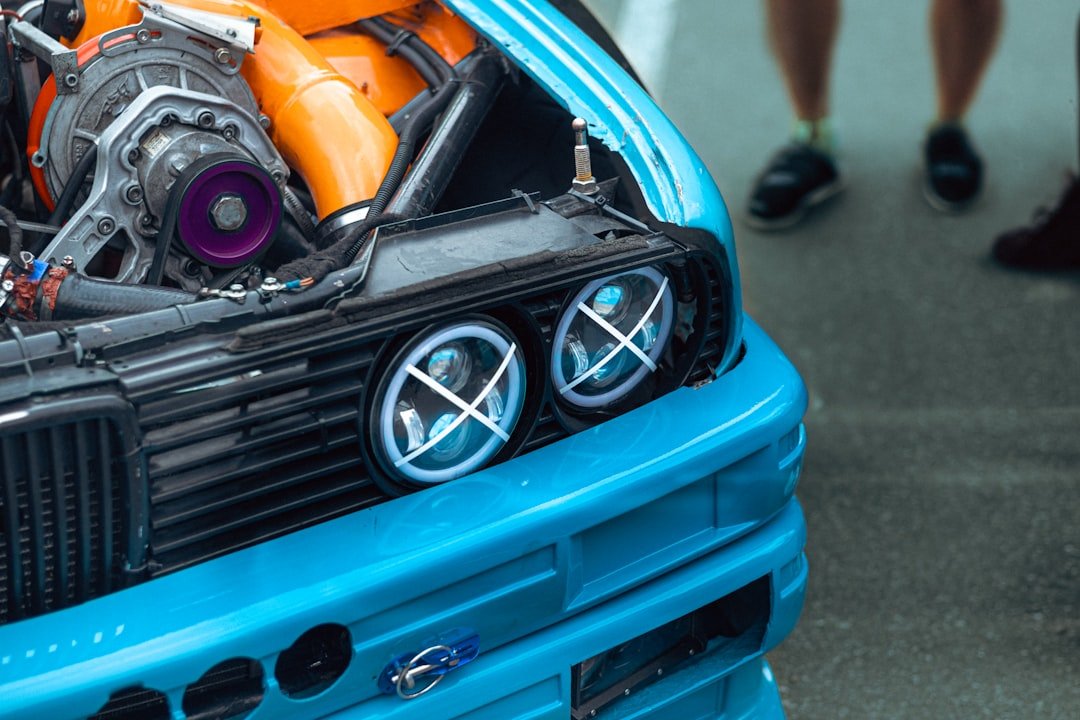 A turbocharged engine is displayed in a blue car.