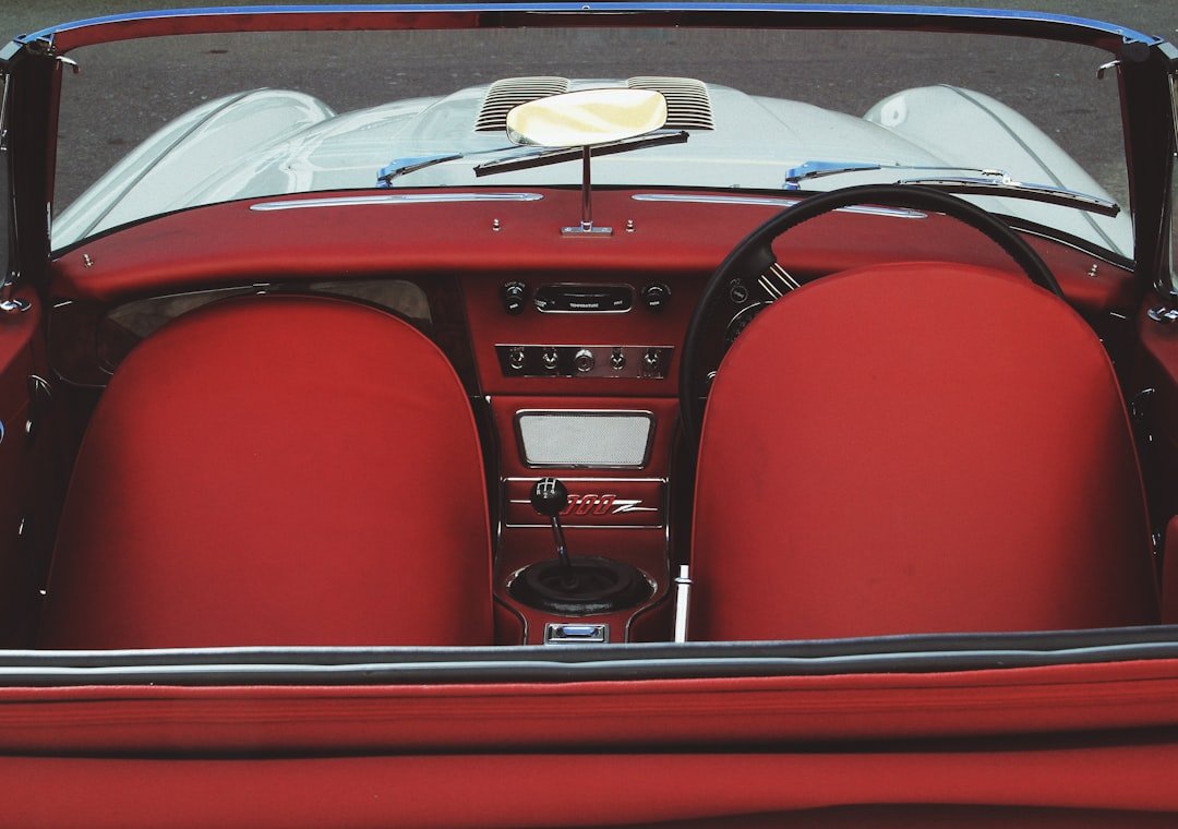 A red convertible car with the top down