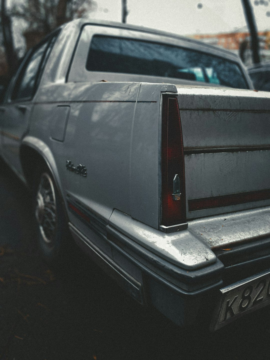 a silver car parked on the side of the road