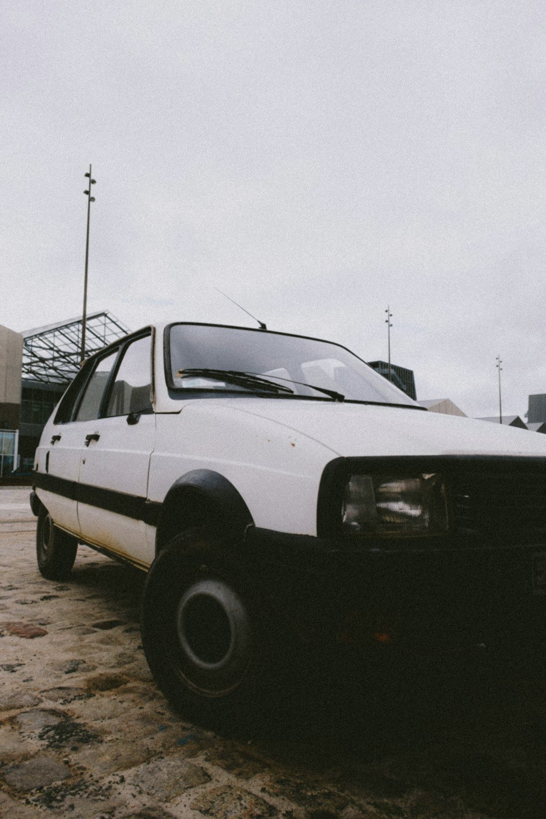 a white pick up truck parked in a parking lot