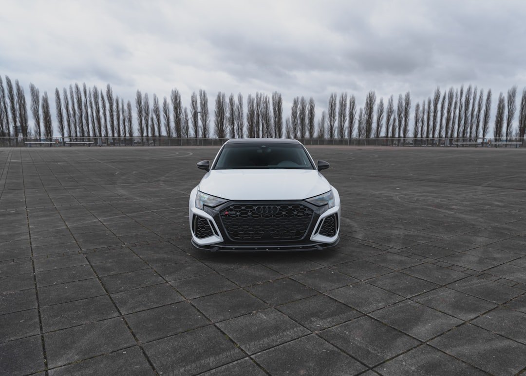 a white car parked in a parking lot