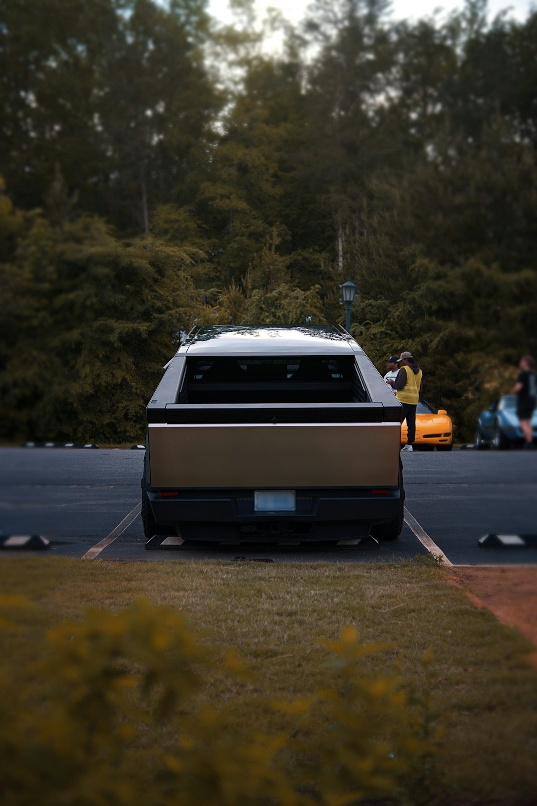Back view of a car parked in a parking lot.