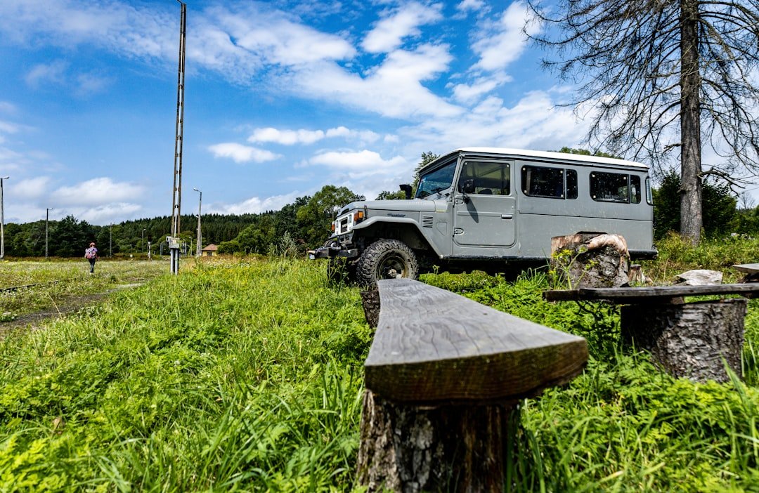 a jeep is parked in the middle of a field