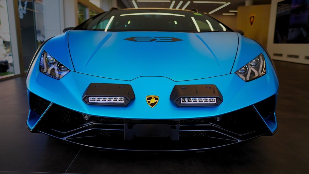 A blue sports car parked in a garage