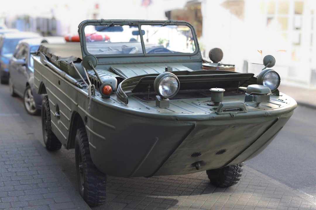 A military vehicle driving down a city street