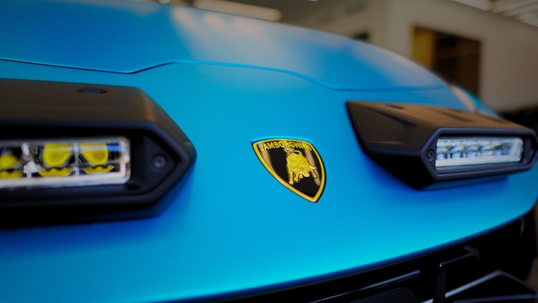 A close up of the front of a blue sports car