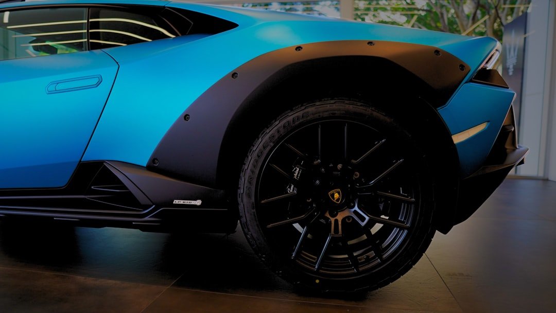 A blue sports car parked in a garage