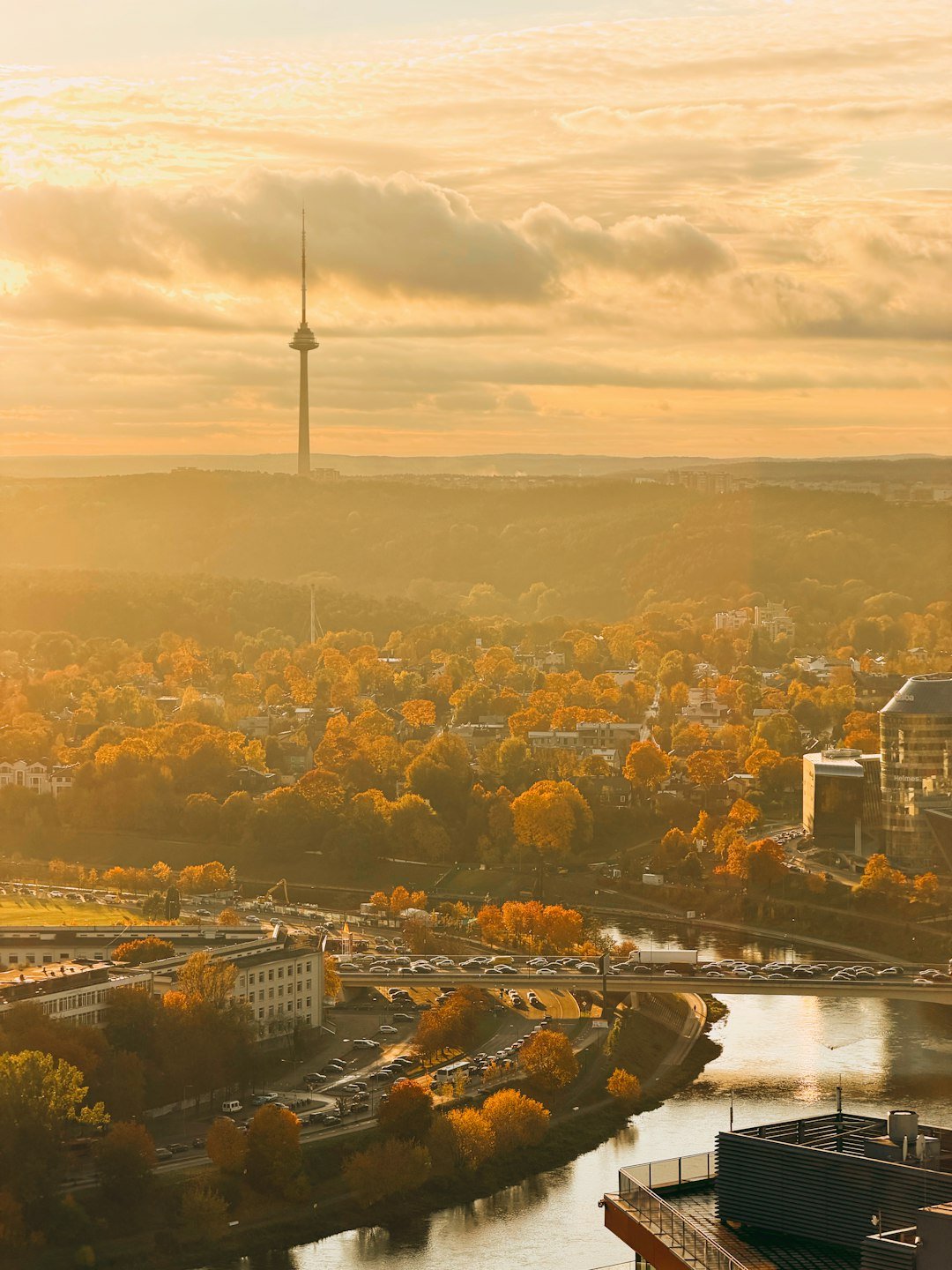 Cityscape with a tall tower at sunrise