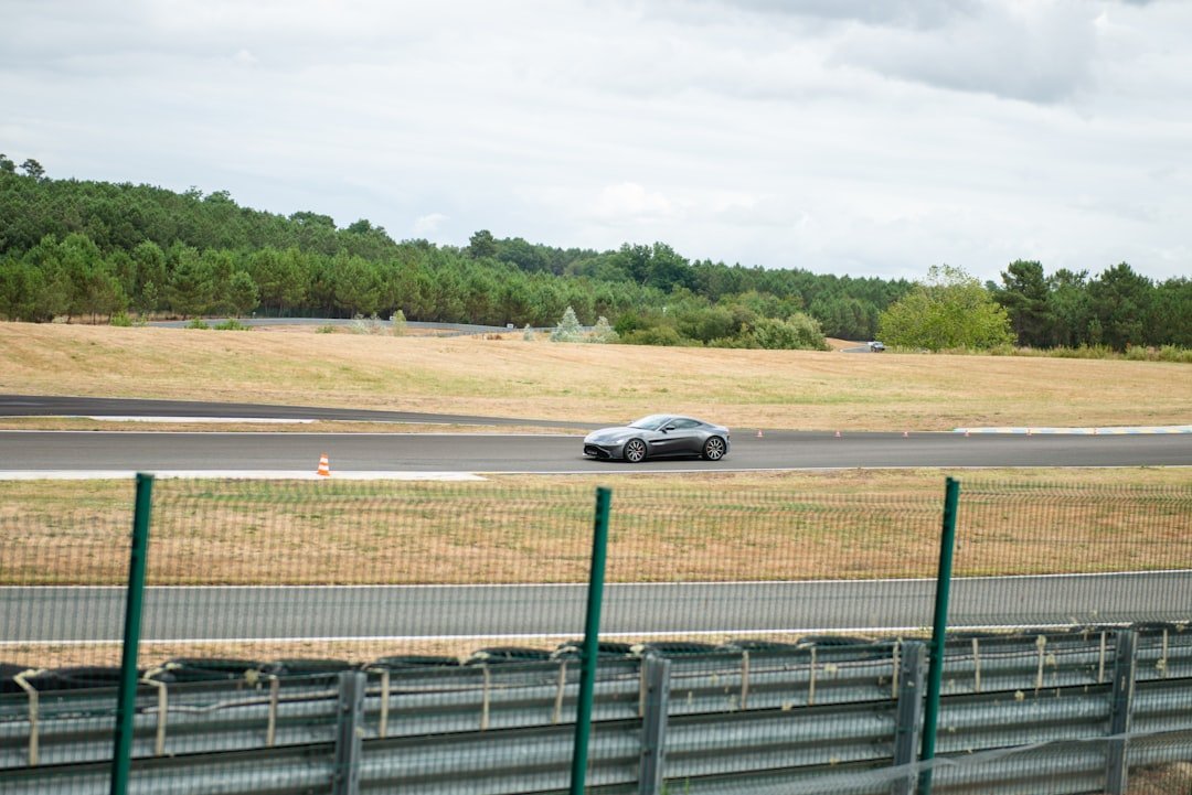 A car speeds along a race track.