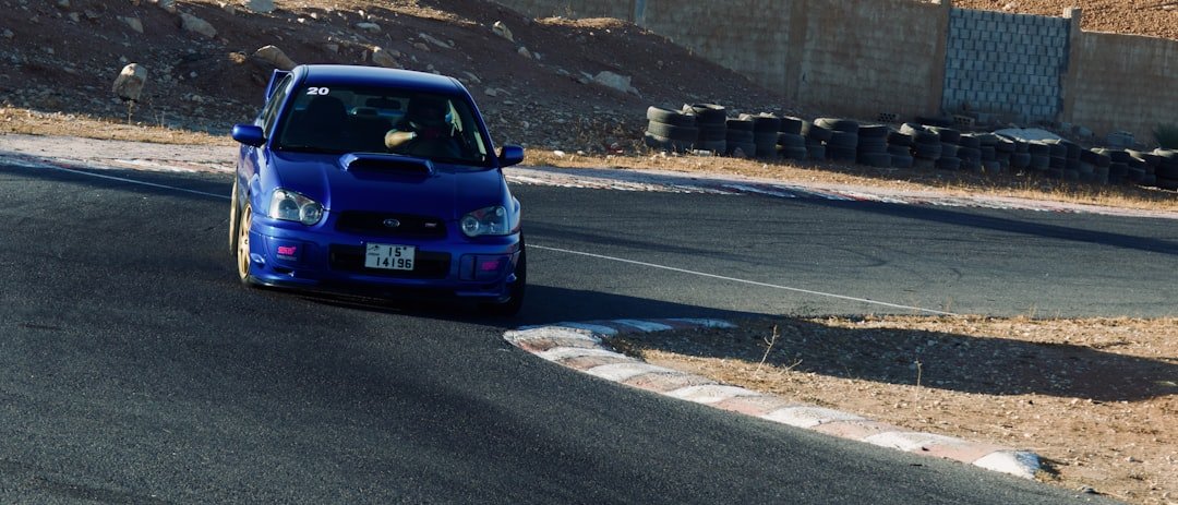 Blue car on a race track cornering