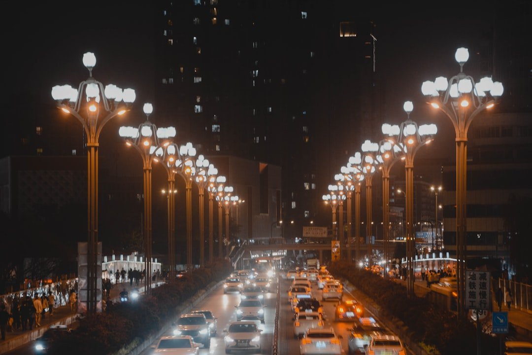 a city street filled with lots of traffic at night