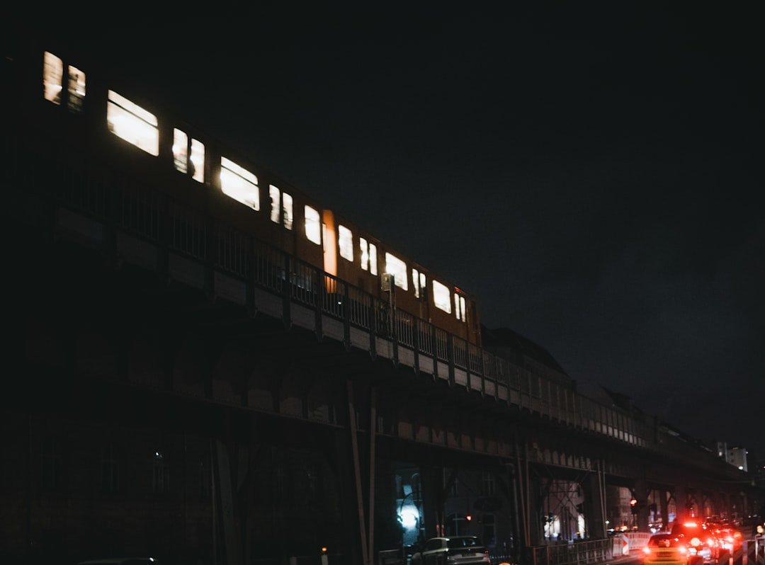 a train traveling over a bridge at night