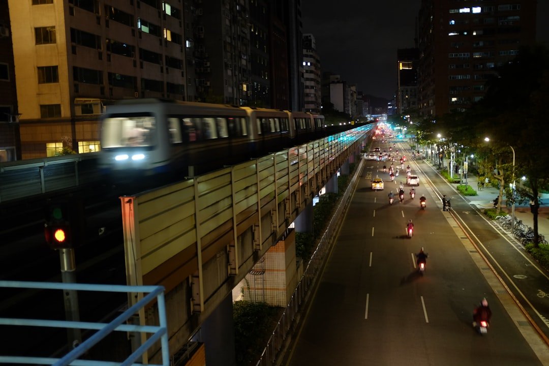 white bus on road during night time