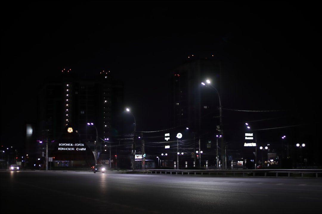 a city street at night with street lights