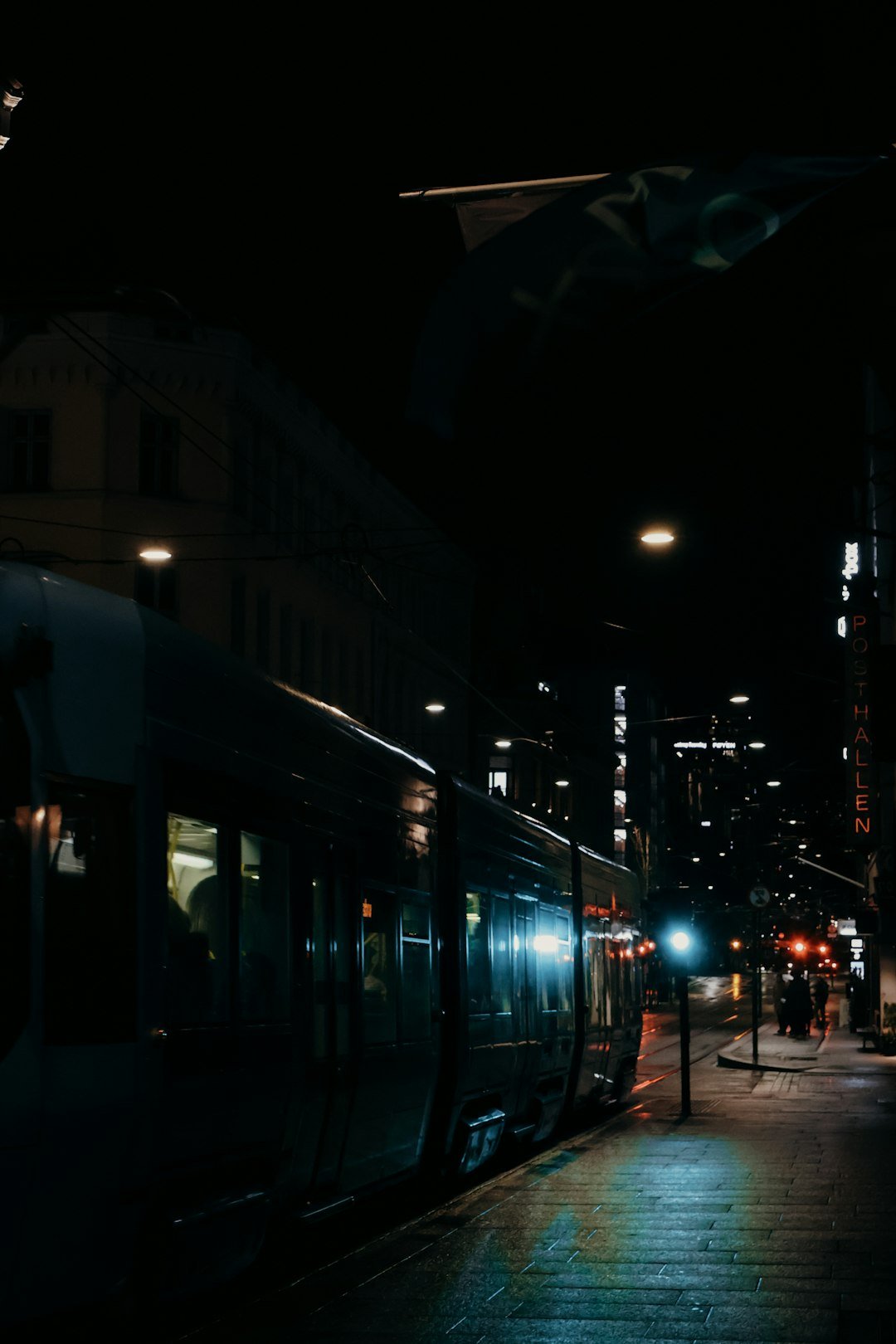 a train on a train track at night